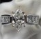 1.01 Marquise Diamond & 1.03 Ct t.w 18K Diamond Wedding Ring, valued at $14,990